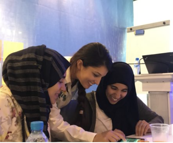 Saloua with girls at Microsoft's Casablanca office through Crafting Love & Hope